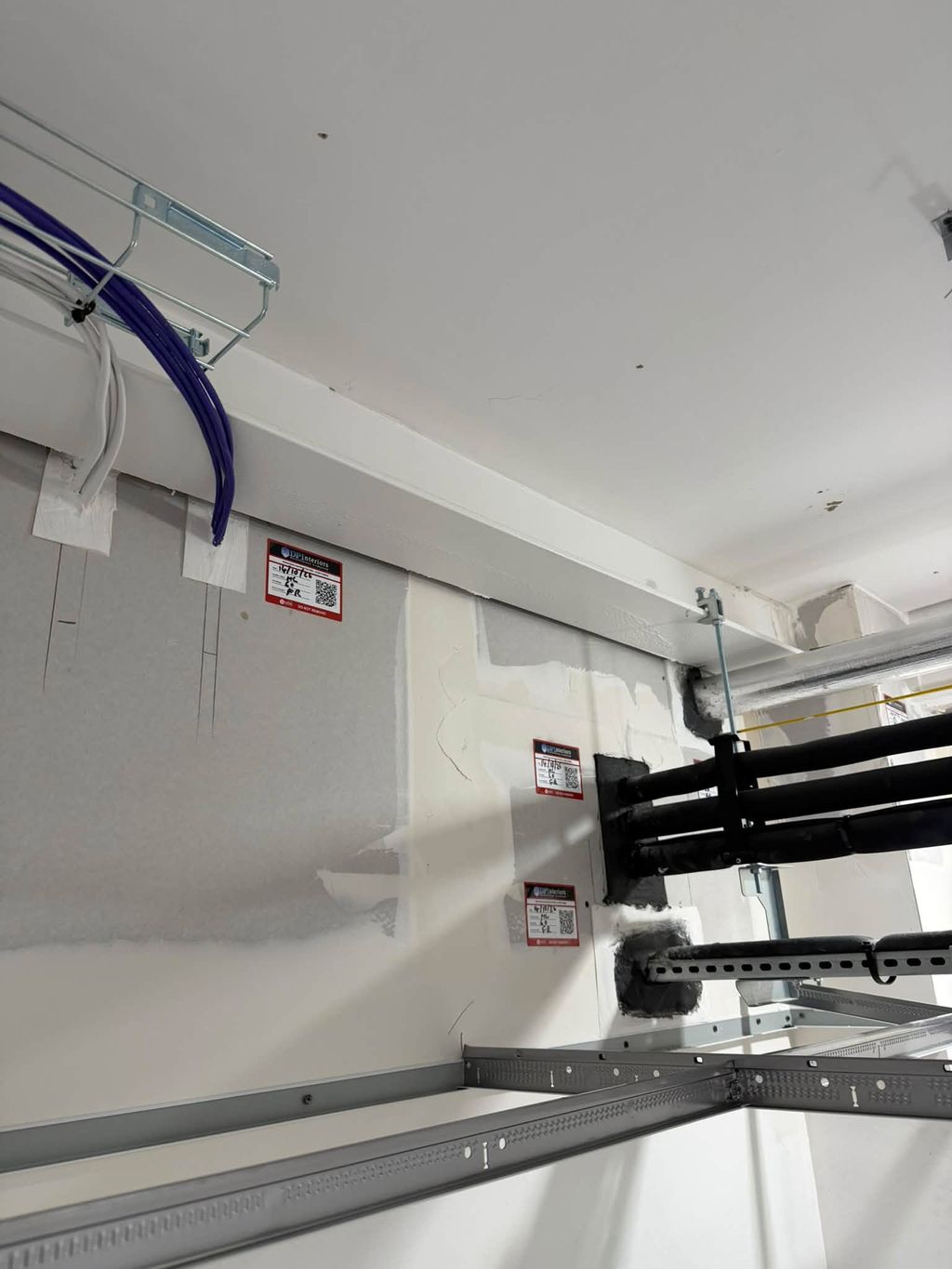 Labelled fire stopping to cables and pipework