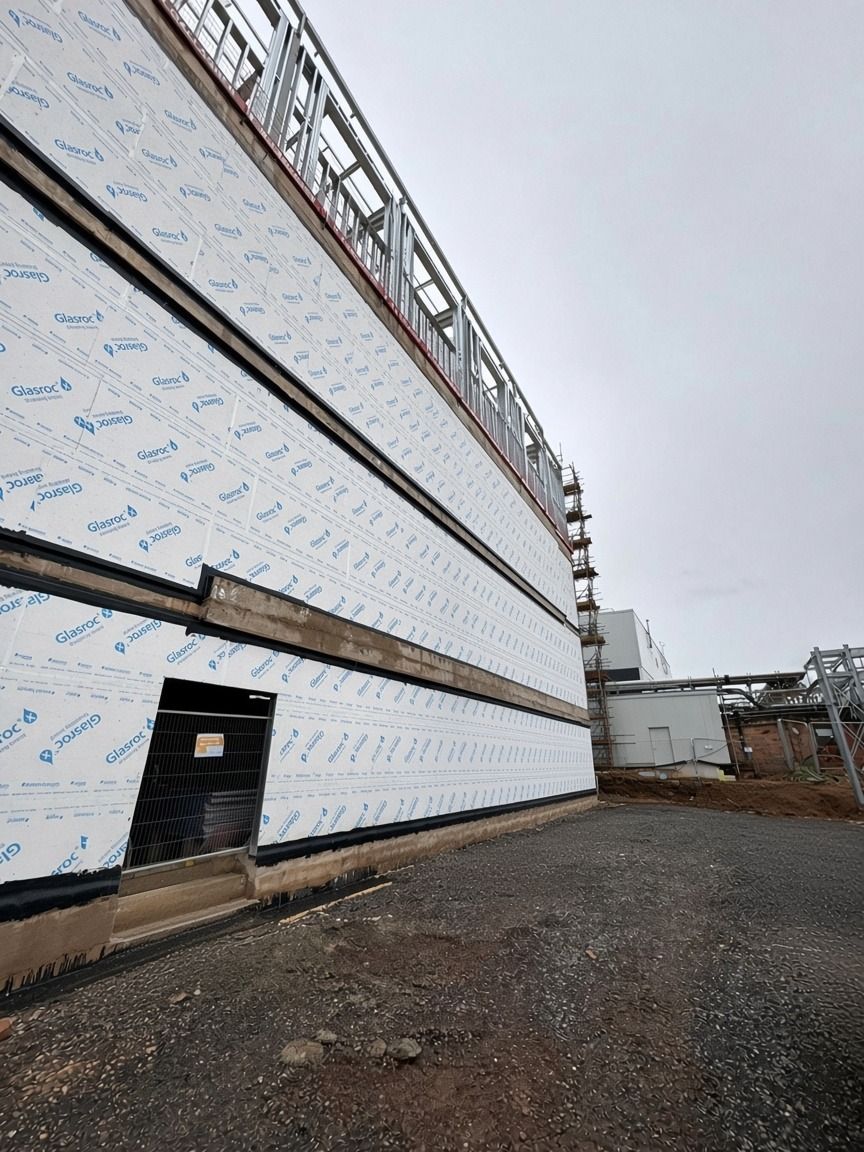Glasroc external sheathing along the elevation, with a door opening formed