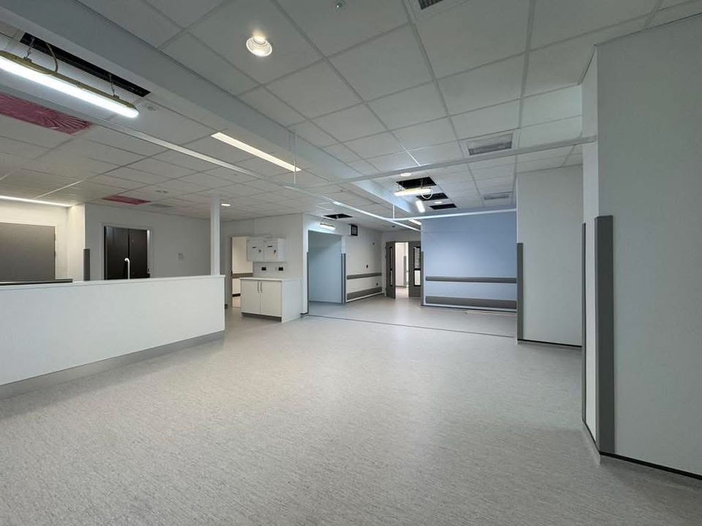 Finished hospital ward with suspended grid ceiling by DP Interiors