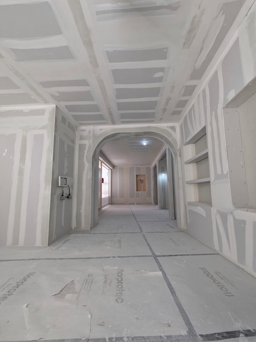Taped drylining with formed arches and built-in shelving