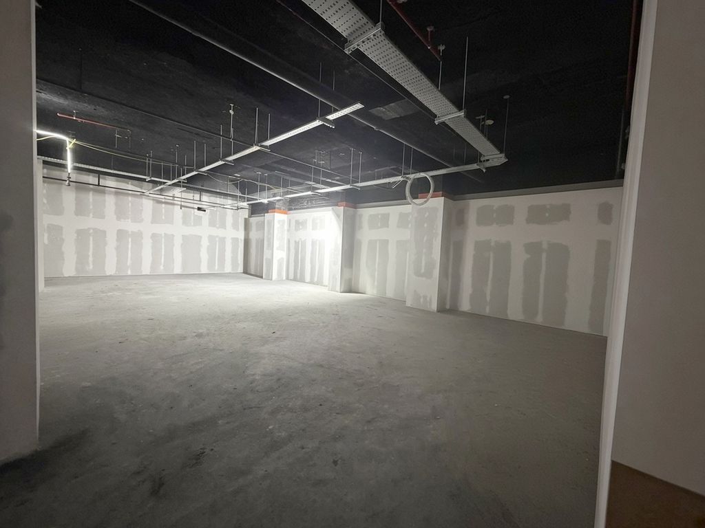 Drylining and tape & jointing under way, with the suspended ceiling grid going in